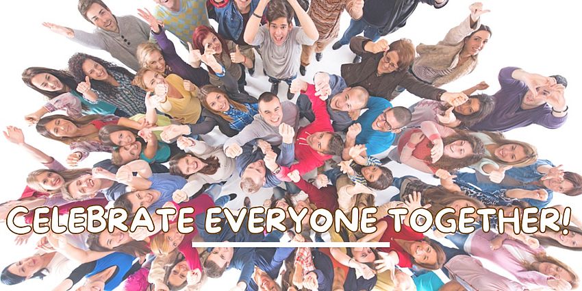 large group of happy people looking up at the camera