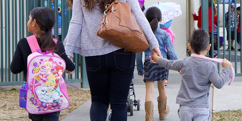 Parents and students walk to school