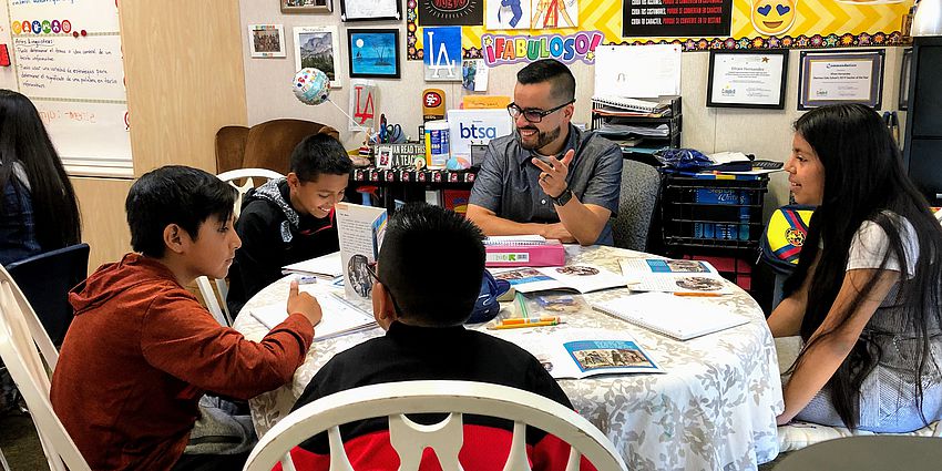 teachers smiles while with students