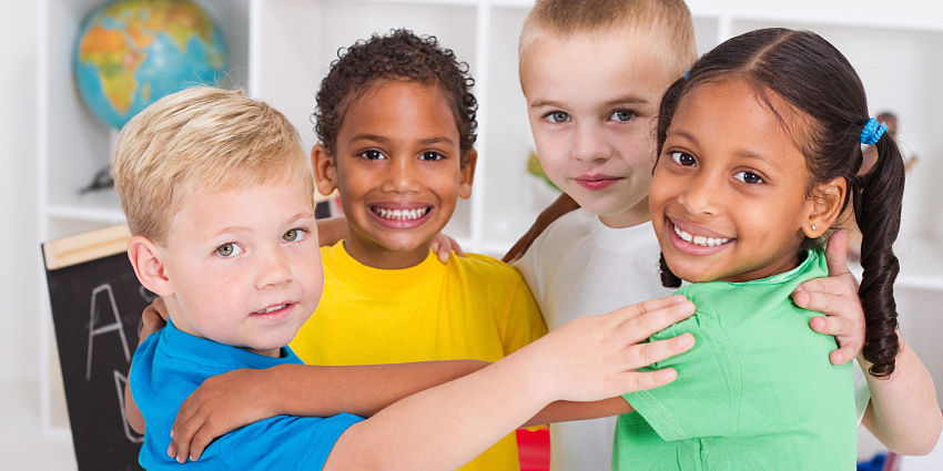 four children hugging