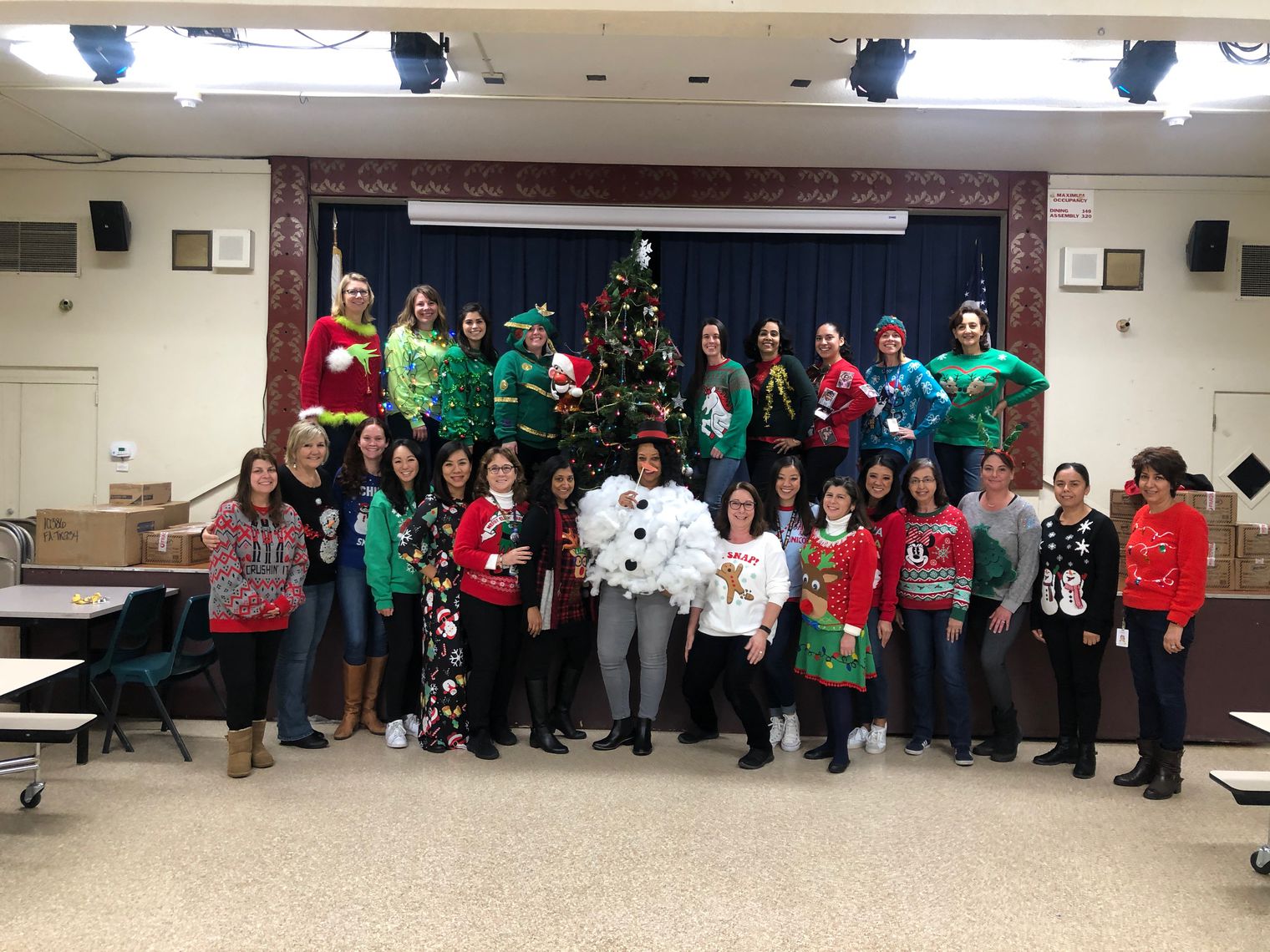 staff dressed in holiday sweaters 